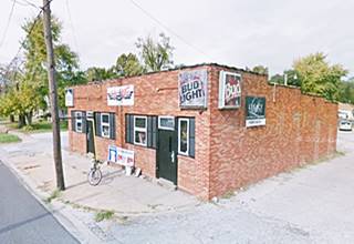 red-brick building, one story by highway