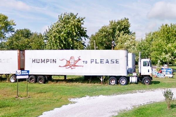 aluminum trailer and truck with a camel and the slogan "Humpin to Please" painted on it