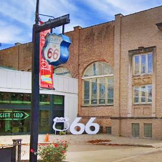 red brick museum, large size US 66 shield and a double six seen from street