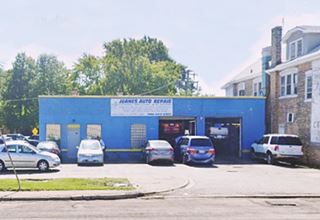 single story block building, service bays, painted blue, a garage