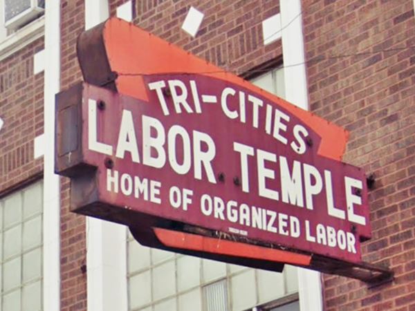 1950s neon sign on red brick building with words "Tri-Cities Labor temple Home of Organized Labor"