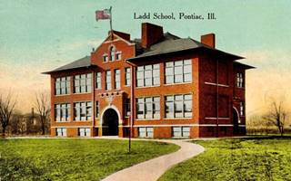 Old Ladd School on US66 Pontiac brick building, a school, 2 stories, hip roof, color linnen postcard c.1920s; LADD SCHOOL PONTIAC ILL.