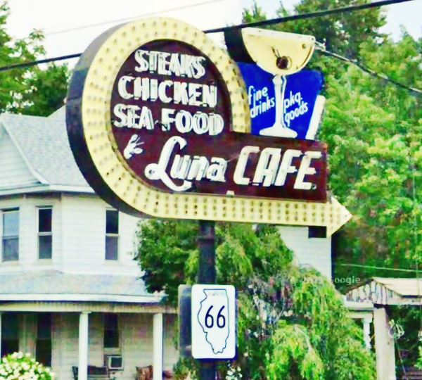 neon sign with a martini glass with an olive and a curved arrow and words
"steaks chicken sea food Luna Cafe fine drings pkg. goods"