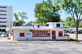 woodframe single story gable roof building, a drive thru