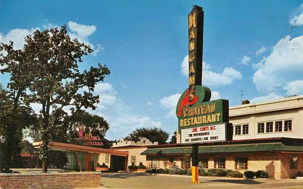 color postcard building with large neon sign, stone walls, canted canopy over side entrance for guests, a restaurant c.1950s