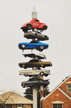 mini Spindle Sculpture US66 Spindle with tiny cars impaled on it by US66
