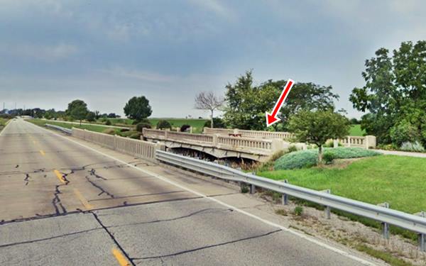 leftt US 66 current lanes, right, a bridge carrying a paed trail