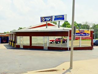 mirrored glass office with parking area in front