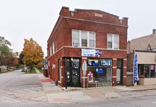 2 story red brick late 1800s former drugstore corner building
