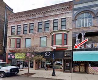 color, 2022 Buildings on a busy street, bay window and hotele entrance MID CITY HOTEL written on door transom
