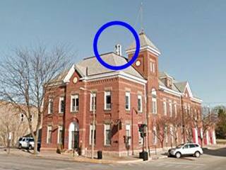 Phone Booth on Lincoln City Hall in Lincoln Phone Booth on top of a building