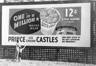 Prince Castles 1930s billboard black and white 1930s billboard, of Prince ICE CREAM Castles, one in a million malt. Woman and child stand in front of it