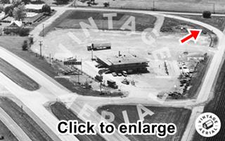 1971 view Pure Truck Stop Black and white 1971 aerial view of 4 lane US66 left, gas station center, and Deadmans curve behind. Office, pumps, signs, cars