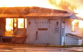 The Riviera burning down color, fire burning a building