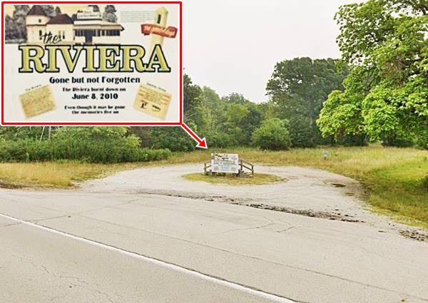 color, gravel drive, sign and marker with steps, trees surround it