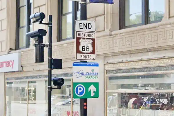 brown sign with white letters Route 66 END