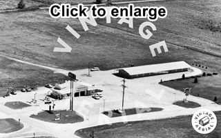 Sands Motel 1971. Braidwood Sands Motel gable roof, single story behind an Arco Station on the corner, black and white 1971 aerial photo