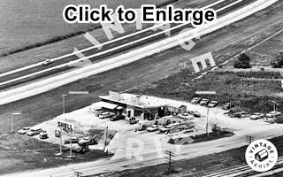 aerial view 1965 L and M Shell, Dwight Il Black and white, 1965 aerial view of a Shell gas station, cars, pumps, signs, and 4-lane US66 and Old 66 converging