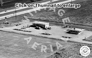 1966 aerial photo Standard station US66 Divenon oblong box station and cafe by 4-lane 66 black and white 1966 aerial photo
