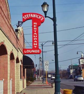 Stefanich chicken taven original neon sign on Route 66, Joliet 1950s red and white letters, a neon sign of a restaurant