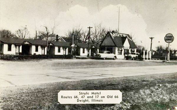 Strufe motel and Cities Service, c.1952 US66 Dwight cottage style Cities Service gas station with sign and pumps, MOTEL written on its roof, motel units behind with gable roof. Cars, highway. Sepia postcard c.1952
