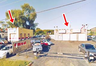 three service bay garage to the right, used cars all about, block shaped single door bld. to the left