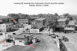 black and white, brick commercial buildings, cars, 2 gas stations, 1930s view of Atlanta downtown