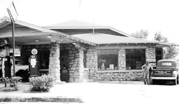 Cornerstone gas station 1950s US66 Galena black and white photo: gas station with old truck and gas pumps
