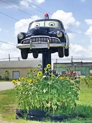 facsimile of a 1949 Mercury police car atop a pole