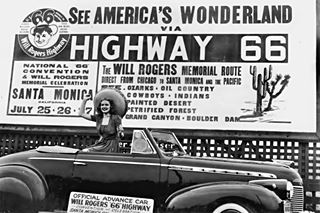 1940s photo of woman in a 1940 Chevrolet Special Deluxe Convertible and a billboard promoting Highway 66 attractions