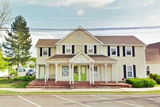 two story gabled home with front porch