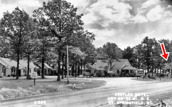 vintage black and white photo of cabins and office by Route 66