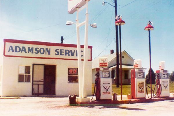 1950s color photo gas station, pumps and home