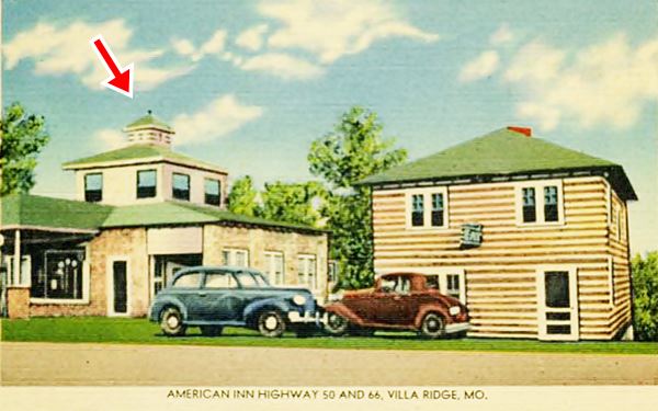 hipped roof 2-story building with cupola on roof and cars in a 1940s color postcard