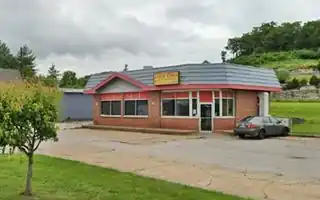1-story building former gas station, mansard roof