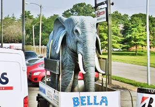 fibrglass statue of an elephant mounted on a trailer