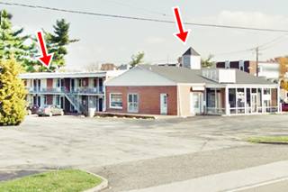 motel office with cupola, tree and two story building with the rooms