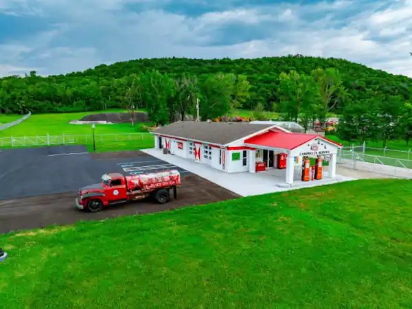 red roofed gas station in field