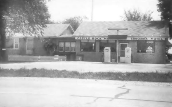 black and white picture of motel office and gas pumps taken in 1967
