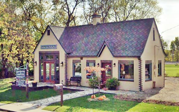 current color view of Tudor style cottage, formerly a Conoco station