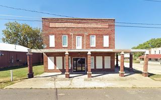 old vacant two story brick hotel on a corner