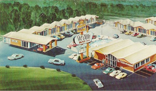 Vintage 1960s color postcard with a painting of the Deville Motor Inn Motel in an aerial view