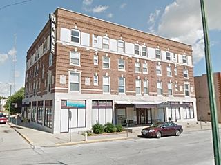 4 story red brick Drake hotel color