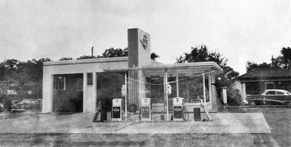 black and white photo ca.1940s Mobil gas station and tires
