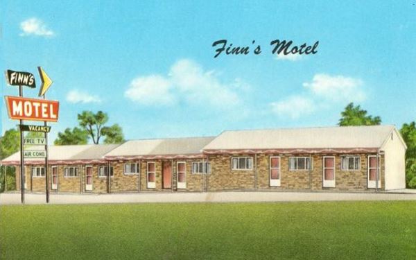 vintage 1960s postcard single story stepped gable roof building: Finn’s Motel