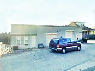 old one story flat roofed, closed garage