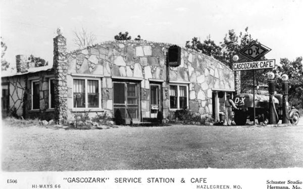 black and white postcard 1940s cafe with D-X gas station, pumps and tanker truck