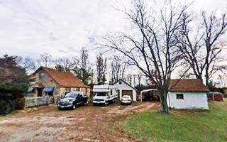 buildings in the trees next to Route 66