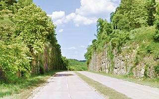 Hooker Cut nowadays, divided highway, rock walls and trees