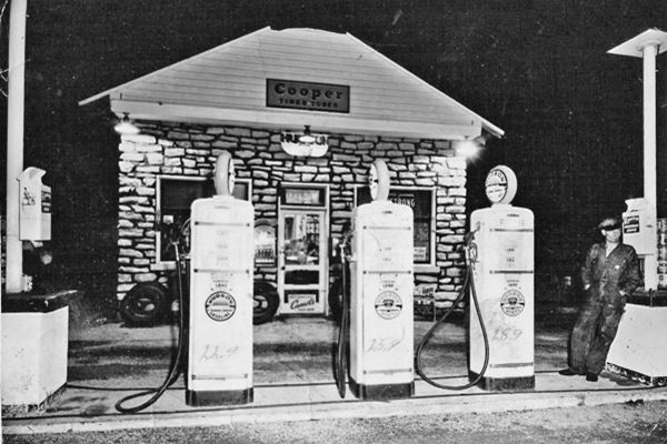 1950s photo gas station, three pumps and attendant